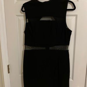 Black sleeveless dress. Cut out back. So cute! Worn once for 2 hours.